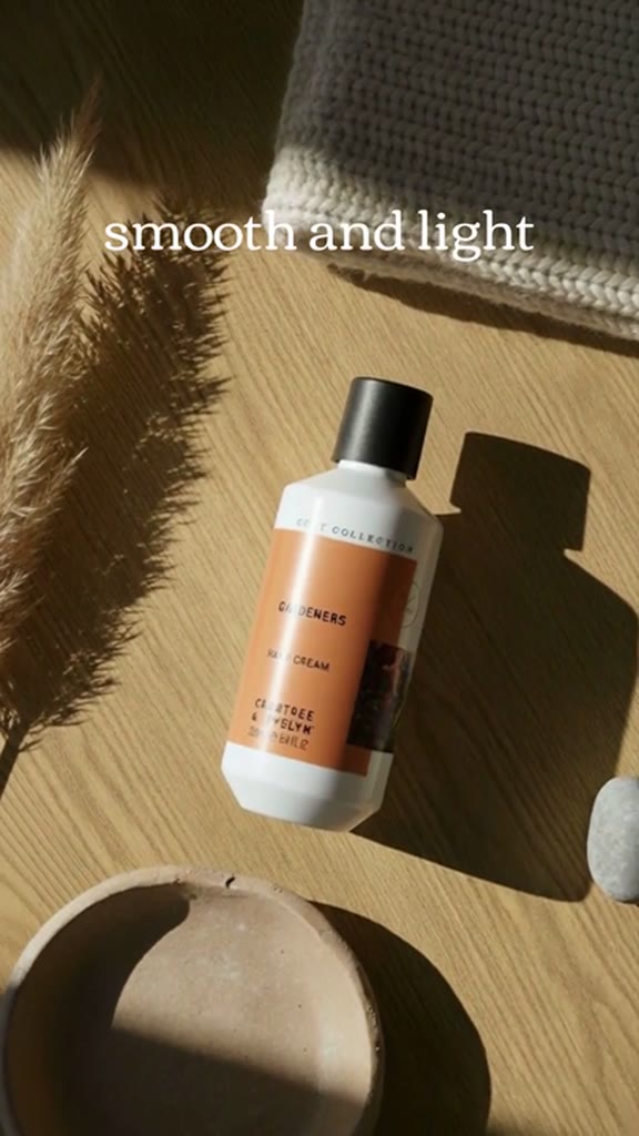 AI-generated hand cream product ad on a sunlit wooden table
