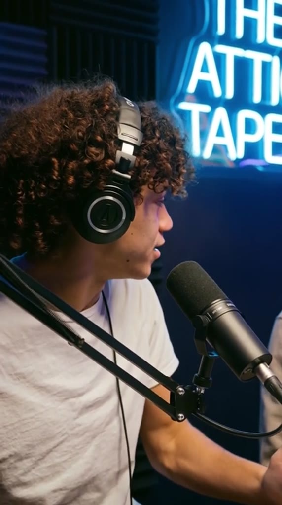 AI-generated podcast clip in a neon-lit recording studio